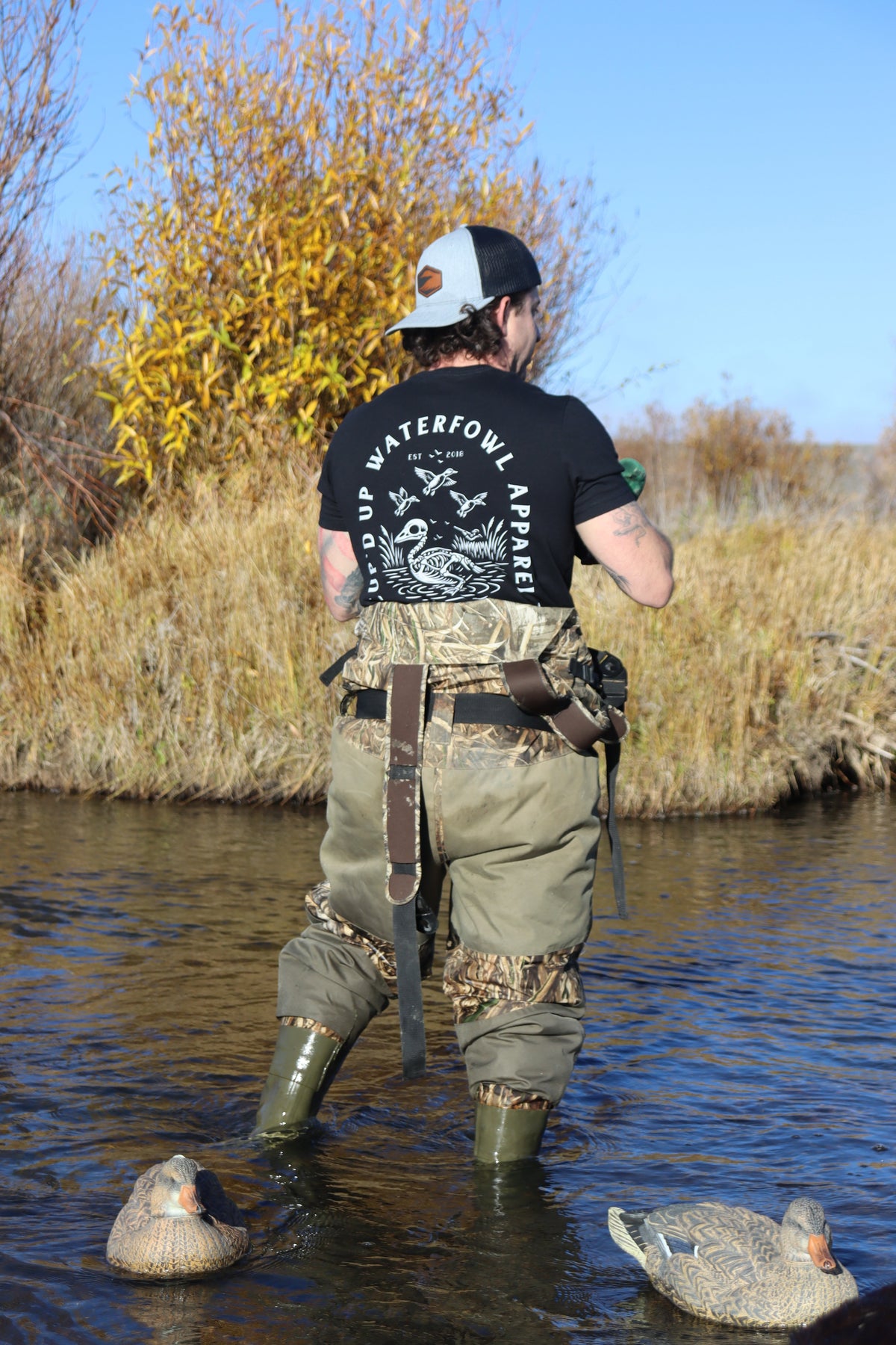 A Man Standing in is waders modeling a Waterfowl Hunting Shirt 